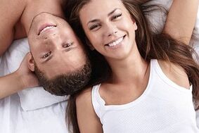 a woman in bed with a man who has naturally increased potential